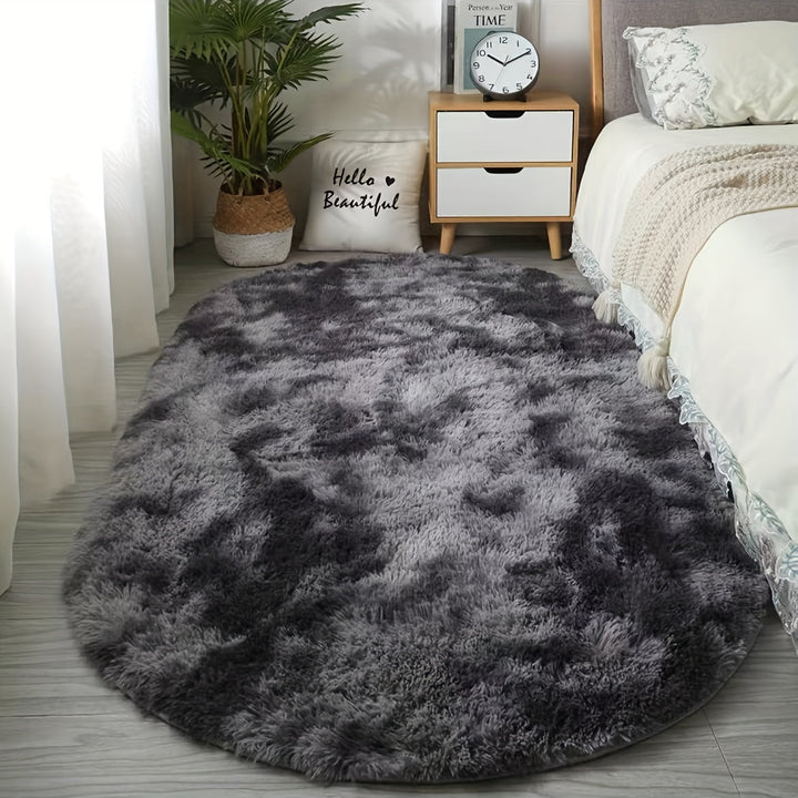 Tapis de sol ovale en peluche douce, parfait pour une décoration intérieure élégante.