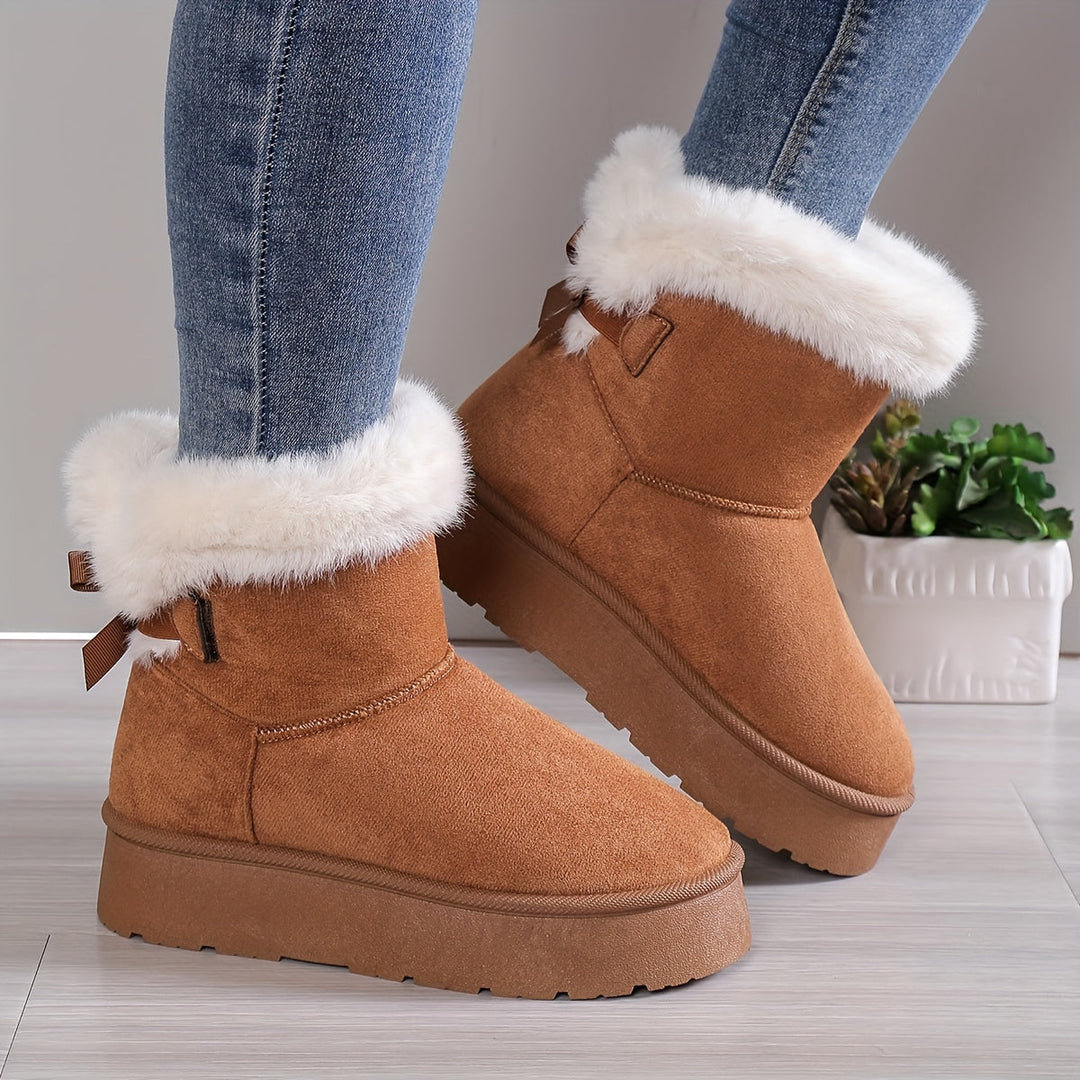 Bottines femme hivernales, design moderne et doublure chaude pour un confort thermique supérieur.