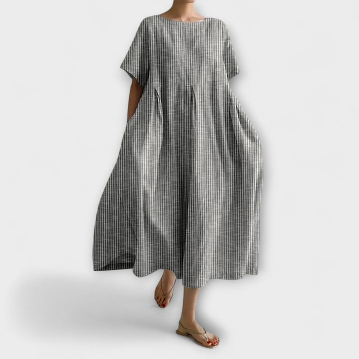 Robe longue femme fluide et confortable, parfaite pour un look décontracté chic. Disponible en plusieurs couleurs.