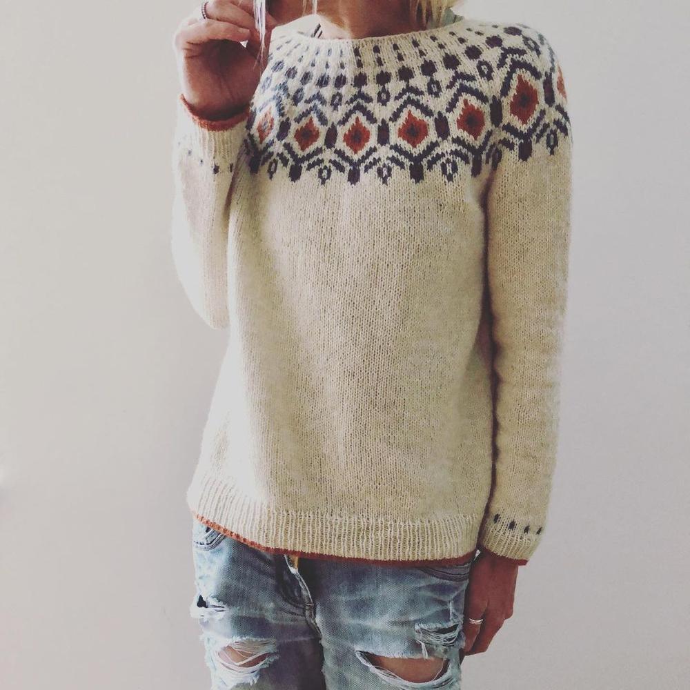 Vêtement hiver féminin: pull chic et confortable à col rond avec motif géométrique distinctif, mode décontractée.