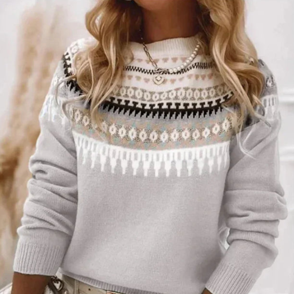 Pull femme en tricot doux avec motifs modernes, col rond. Manches longues, idéal pour le confort et le style d'hiver.