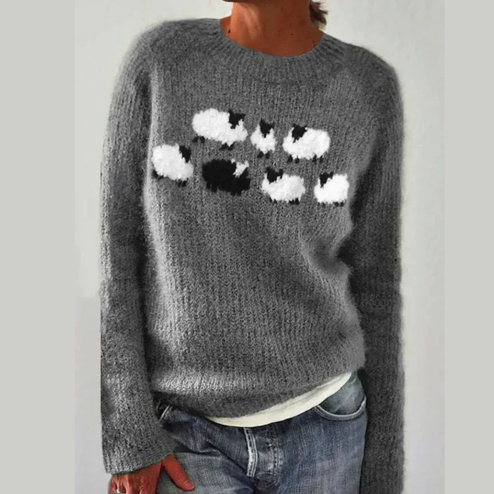 Détail des motifs élégants du pull femme, texture douce. Vêtement mode femme chic et chaud pour l'hiver.