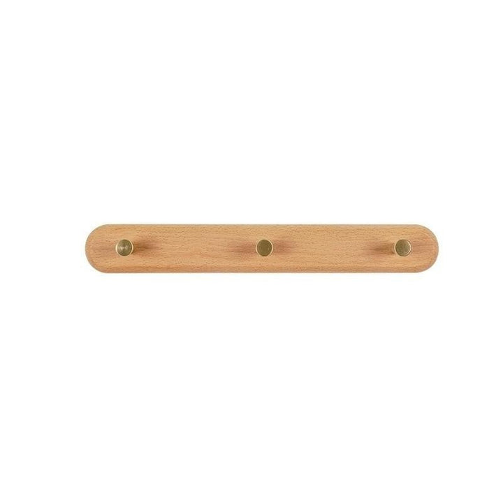 Décoration murale et rangement : porte-manteau en bois de hêtre avec accents en laiton doré.