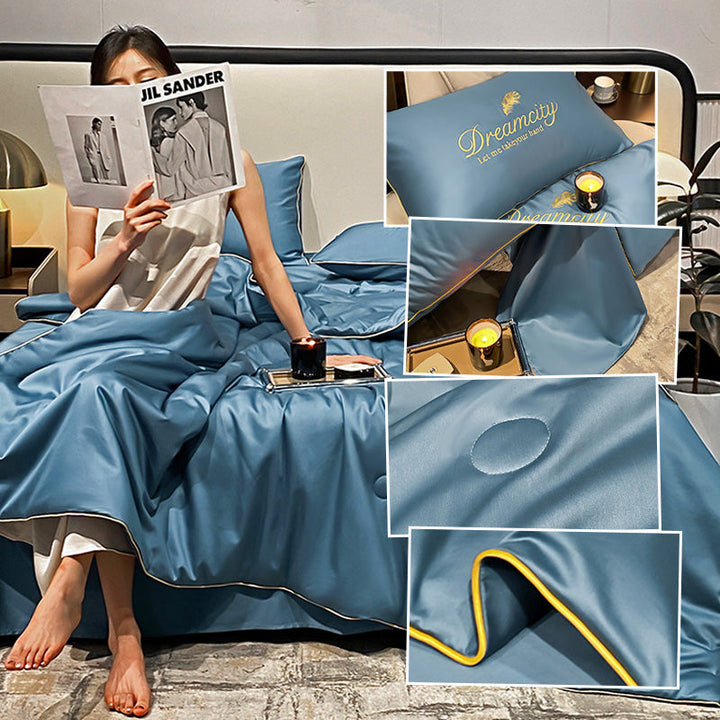 Couette rafraîchissante en soie glacée CoolWrap drapée sur un lit, prête pour l'été.