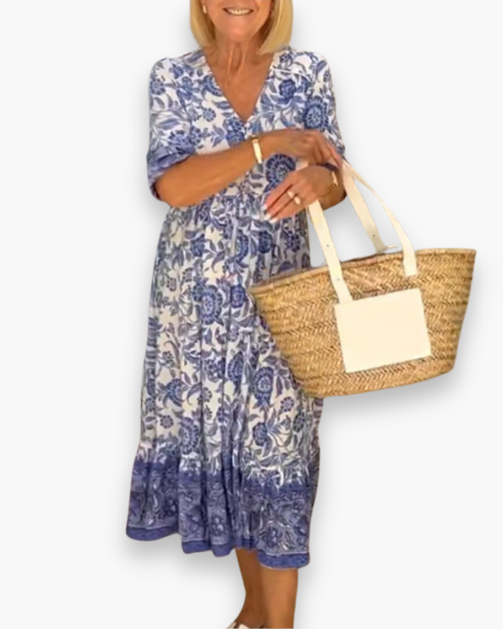 Superbe robe midi femme à imprimé fleuri, parfaite pour l'été et le printemps. Vêtement mode chic.