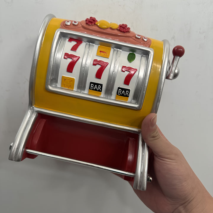 Porte-papier toilette mural "Jackpot" en résine, design machine à sous pour une touche unique aux toilettes.