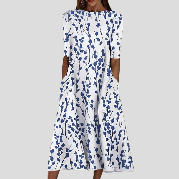 Robe midi fleurie femme en coton, manches courtes, style bohème élégant. Parfaite pour l'été.