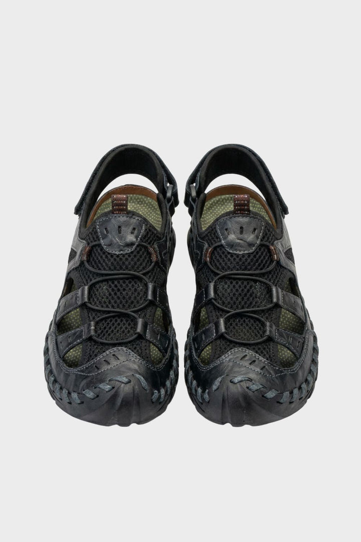 Sandales de trekking Cole homme robustes, idéales pour la randonnée et l'extérieur, offrant confort et adhérence.