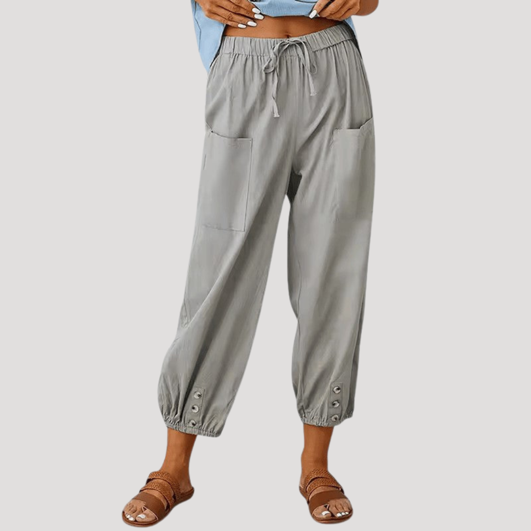 Pantalon femme décontracté fluide, taille haute, confortable. Idéal pour un look casual avec chevilles resserrées.
