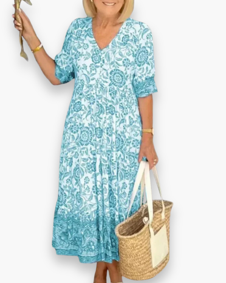 Magnifique robe midi fleurie pour femme. Un vêtement chic et printanier, parfait pour l'été.