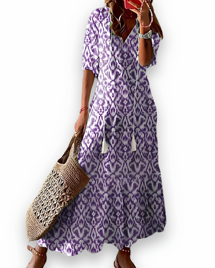 Élégante robe maxi femme imprimée à motifs, coupe fluide et légère, parfaite pour les journées d'été.