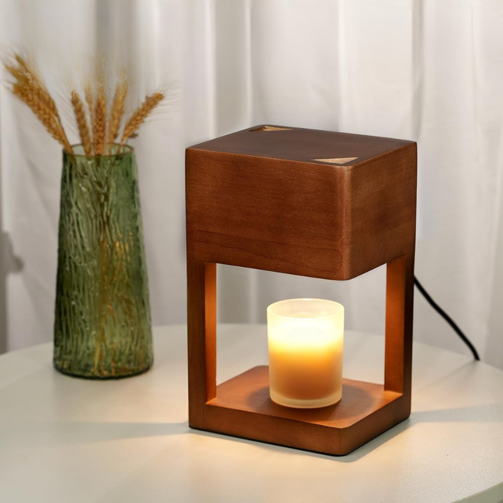 Lampe de table moderne réchauffe-bougie, design scandinave pour une ambiance apaisante et chaleureuse.