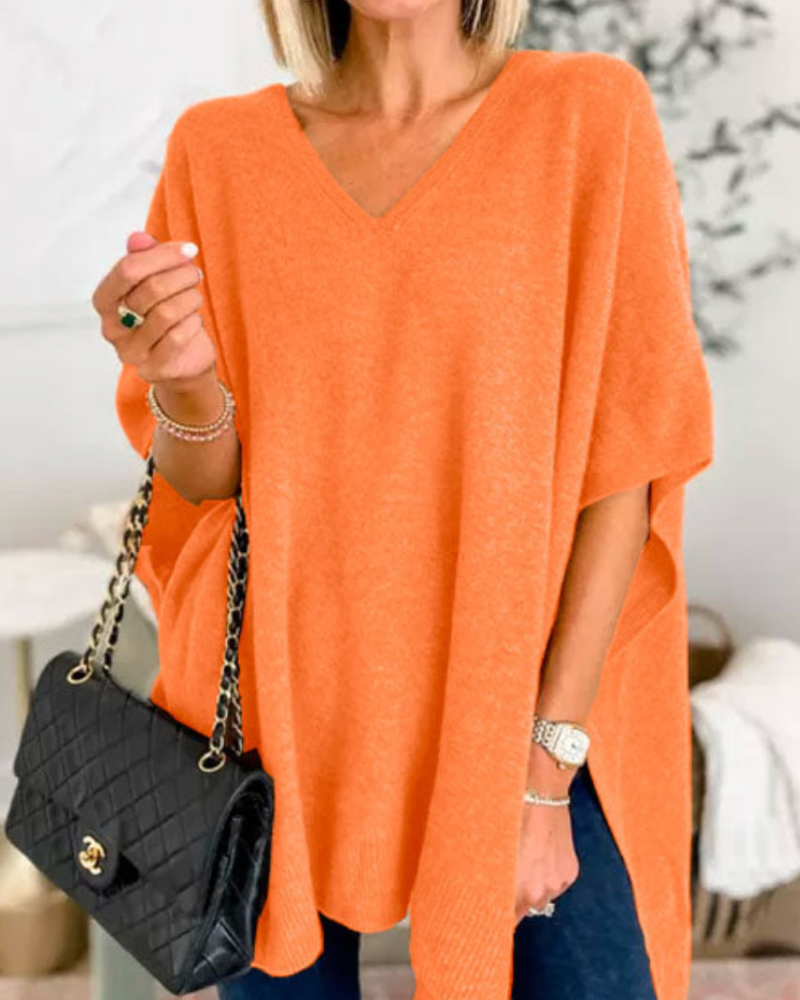 Pull femme élégant et chaud, coupe ample avec col V, idéal pour un look hivernal confortable.