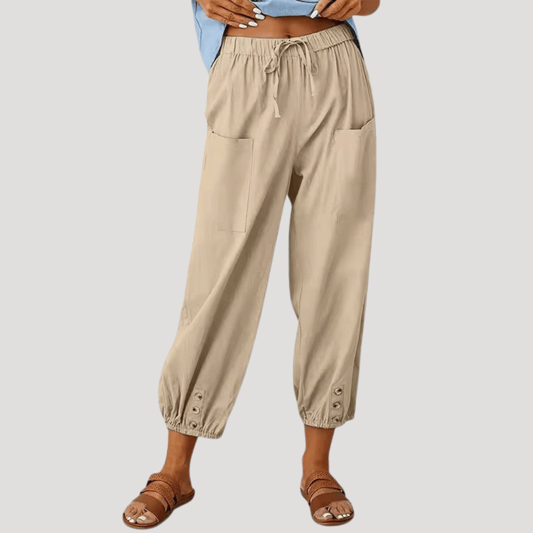 Pantalon femme décontracté fluide, taille haute, confortable. Look casual chic avec chevilles resserrées.