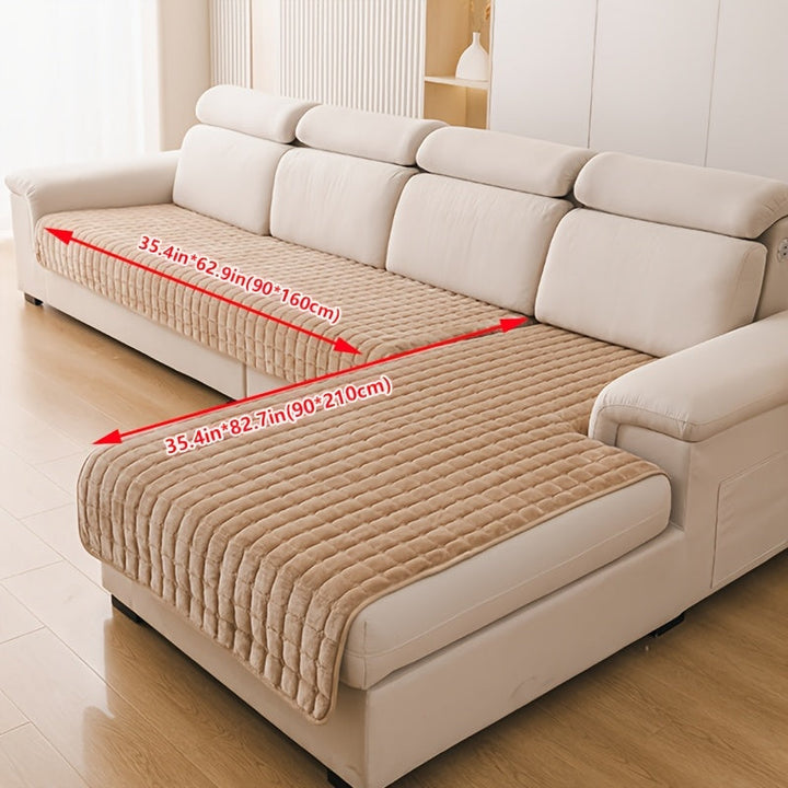 Housse canapé matelassée taupe, élégante et pratique, parfaite pour un salon chic et protégé.