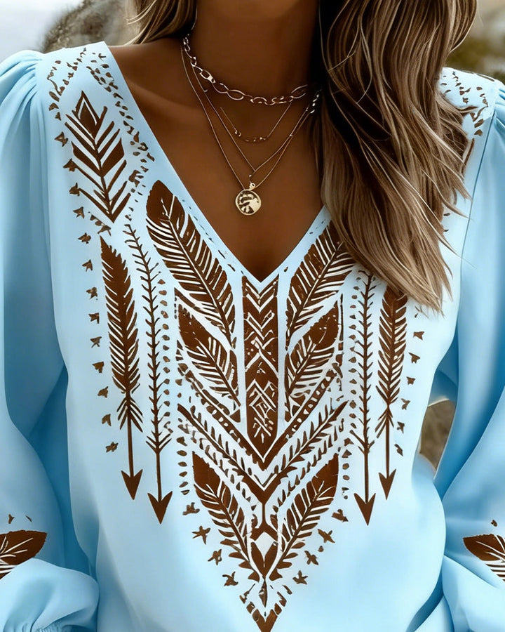 Blouse élégante femme à manches bouffantes et décolleté V. Style bohème chic décontracté pour vos tenues estivales.