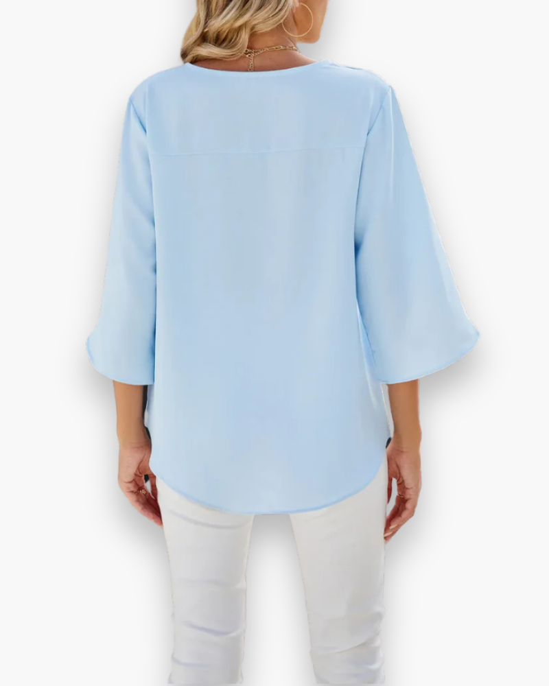 Chic blouse femme col V, coupe élégante, parfaite pour un look mode et raffiné.