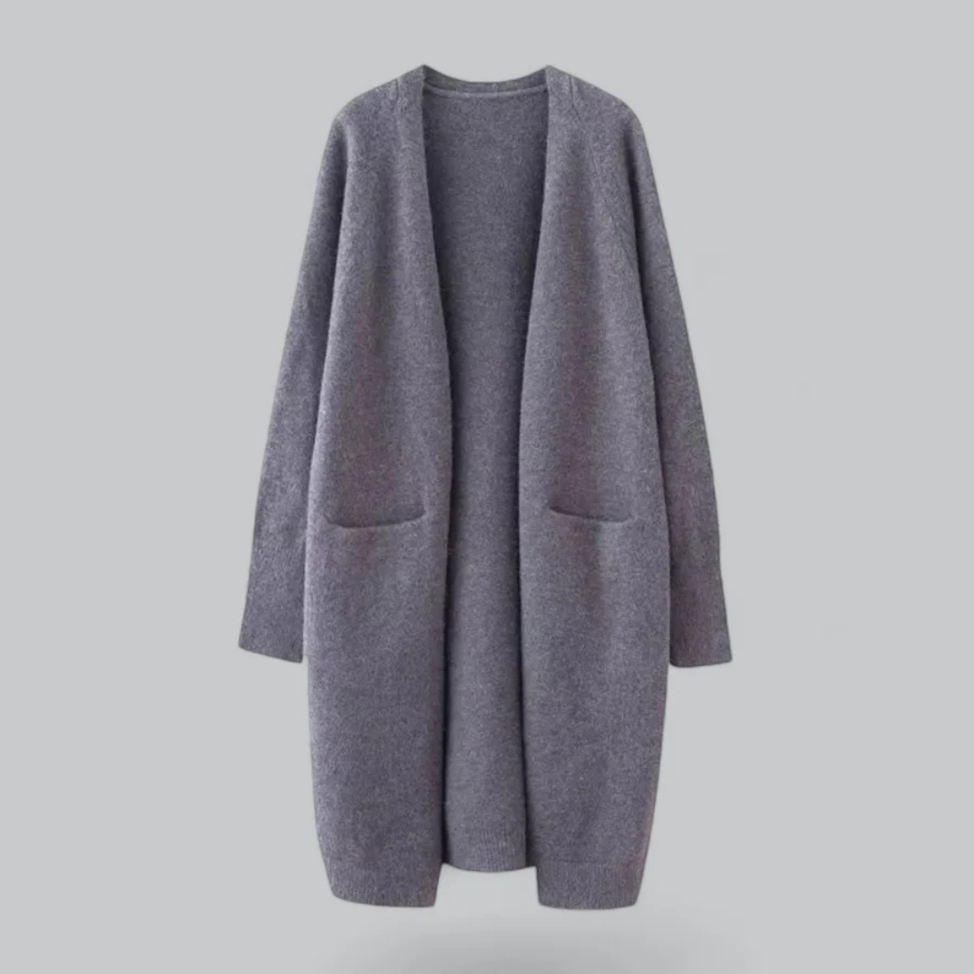 Veste cardigan longue femme chic à poches, idéale pour les journées fraîches d'automne et de printemps.