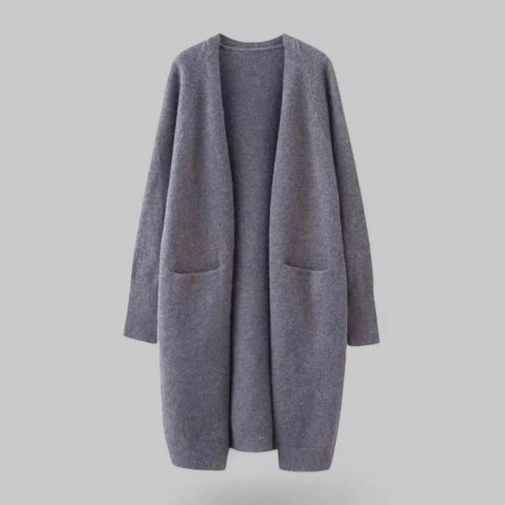 Veste cardigan longue femme chic à poches, idéale pour les journées fraîches d'automne et de printemps.