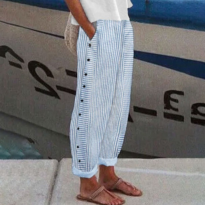Pantalon Pia femme mode avec taille élastiquée, poches pratiques et tissu confortable, parfait pour un style décontracté.