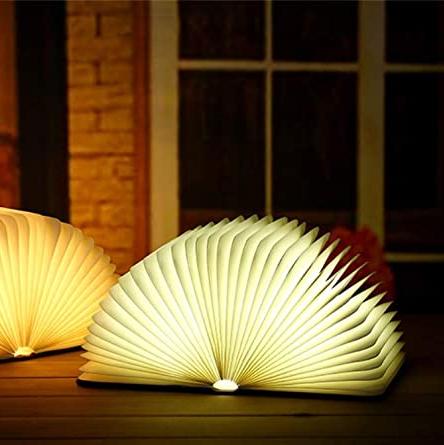 Lampe livre LED pliante, crée une ambiance douce et élégante pour toute pièce.