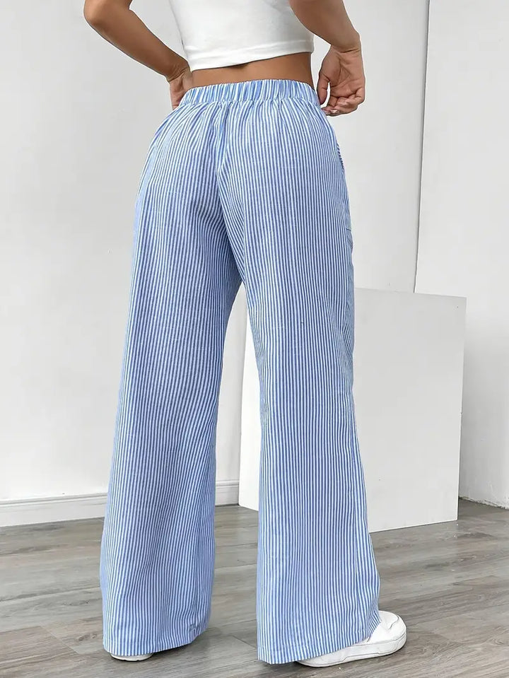 Pantalon femme chic, rayures, coupe large et agréable à porter.