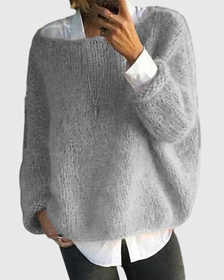 Pull sophistiqué pour femme, coupe moderne et confortable, idéal pour les tenues d'automne et d'hiver chic.