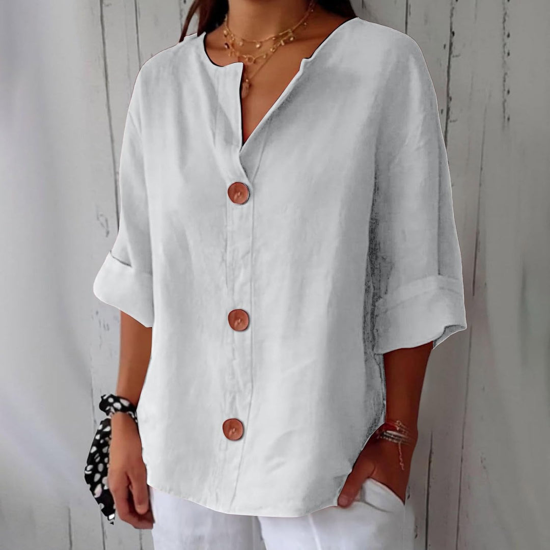 Chemisier femme d'été, col tunisien, coupe ample, pour un look chic et décontracté.