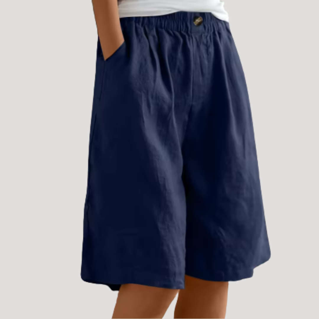 Pantalon court femme, bermuda chic à taille élastique. Coupe ample et fluide pour un confort estival.