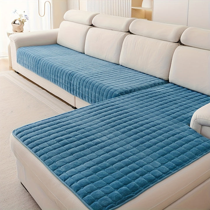 Couverture de protection canapé matelassée en flanelle, confort supérieur et entretien facile pour salon.