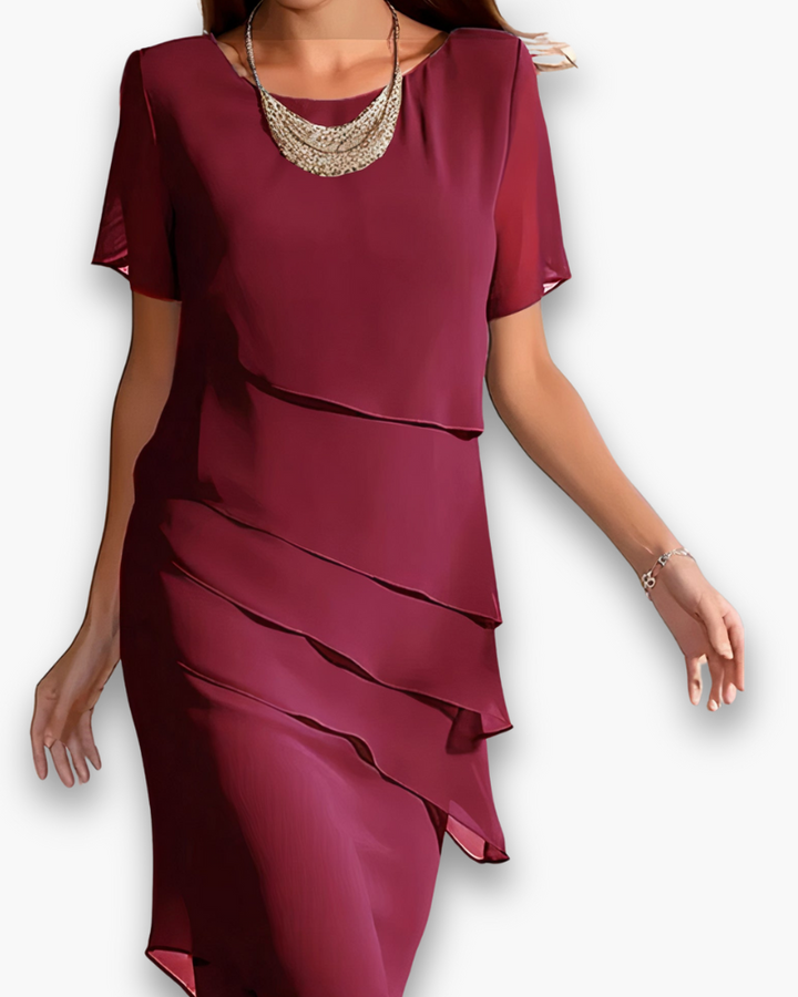 Robe de cérémonie femme chic midi, parfaite pour mariage ou soirée élégante. Tissu raffiné printemps/été.