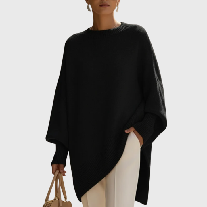 Poncho pull femme moderne, style oversize facile à porter, confort décontracté pour un look tendance.