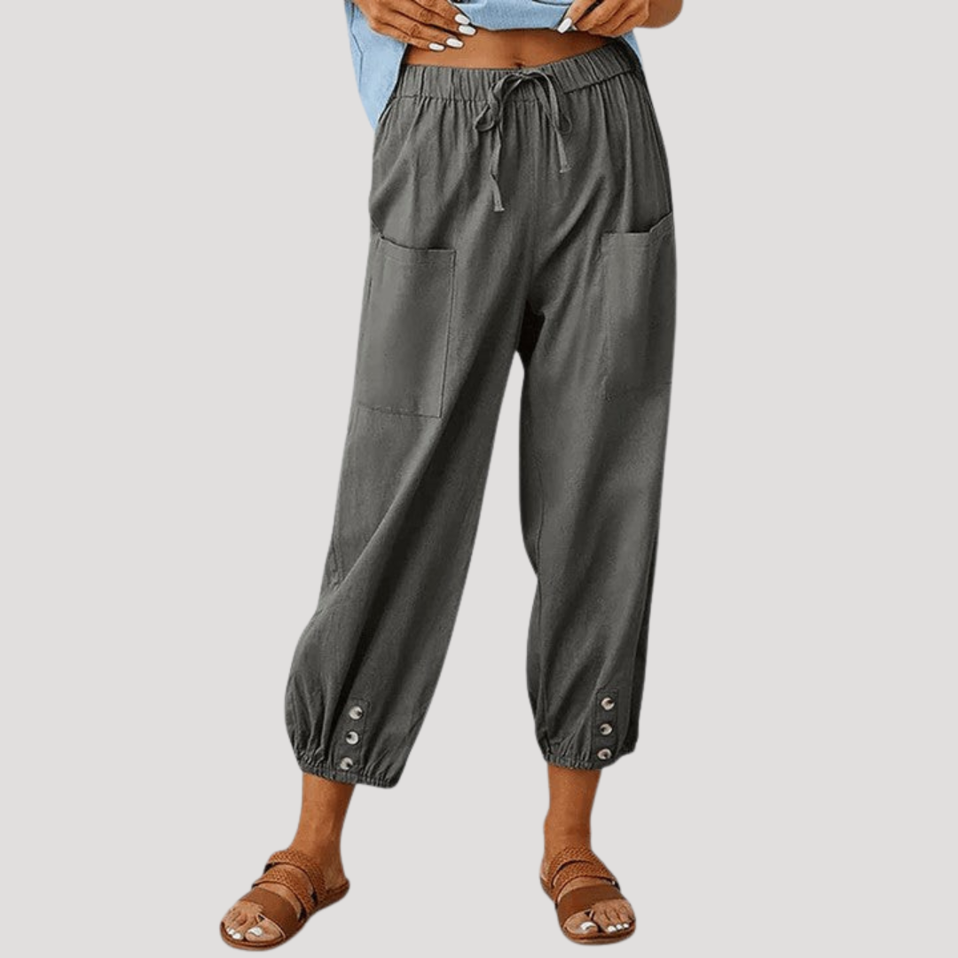 Pantalon fluide femme polyvalent, décontracté et confortable. Coupe ajustée aux chevilles, taille haute.
