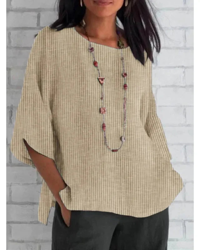 Élégante chemise fluide femme coupe large à manches trompette. Style polyvalent, printemps-été.