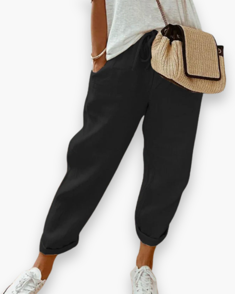 Pantalon femme ample à taille élastique, fluide et confortable. Idéal pour la mode décontractée d'été.