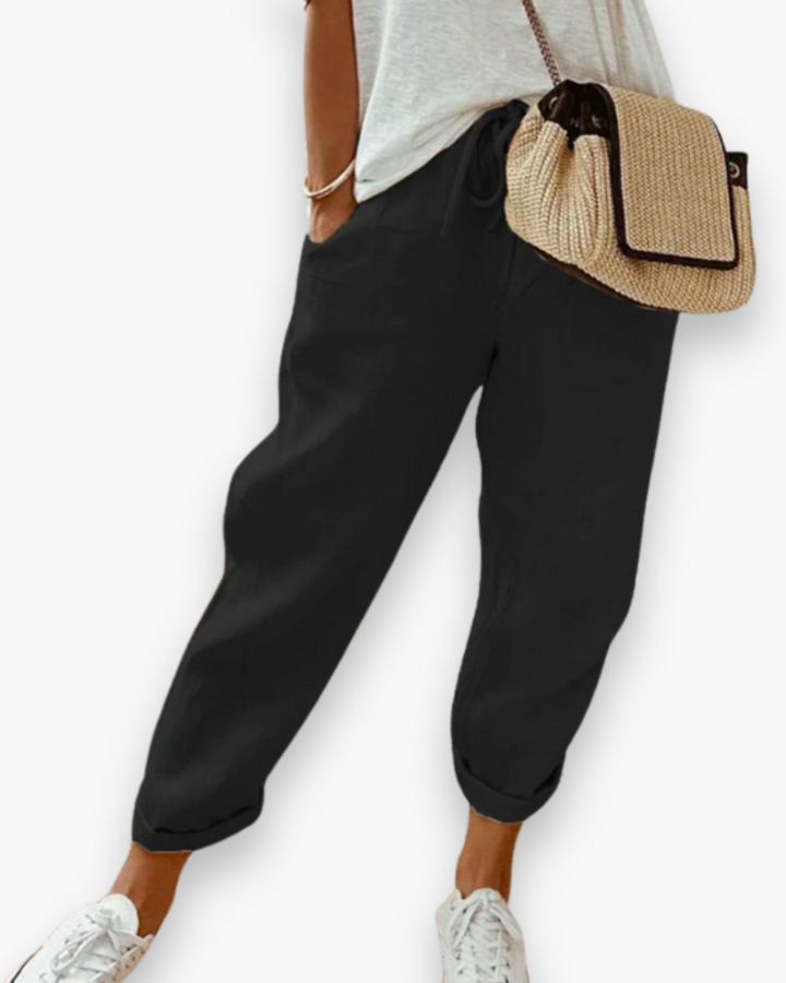 Pantalon femme ample à taille élastique, fluide et confortable. Idéal pour la mode décontractée d'été.