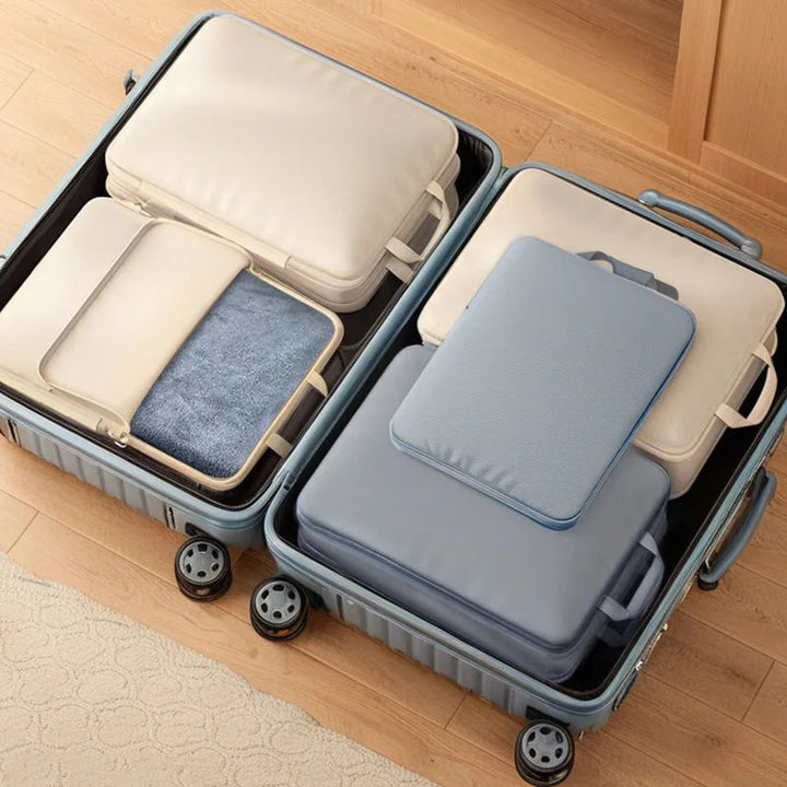 Organisateur de valise compressible pour vêtements, parfait pour un voyage bien rangé et une optimisation du bagage.