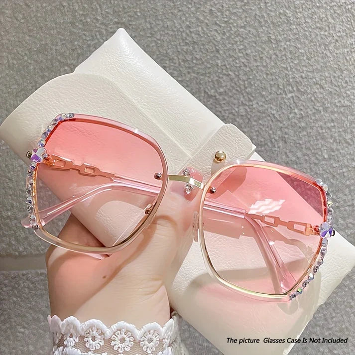 Lunettes de soleil femme luxe, sans monture, ornées de cristaux, pour un look éblouissant et mode.
