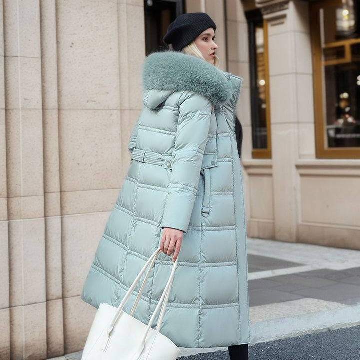 Manteau long matelassé femme, col fausse fourrure. Parfait pour les jours froids d'hiver.