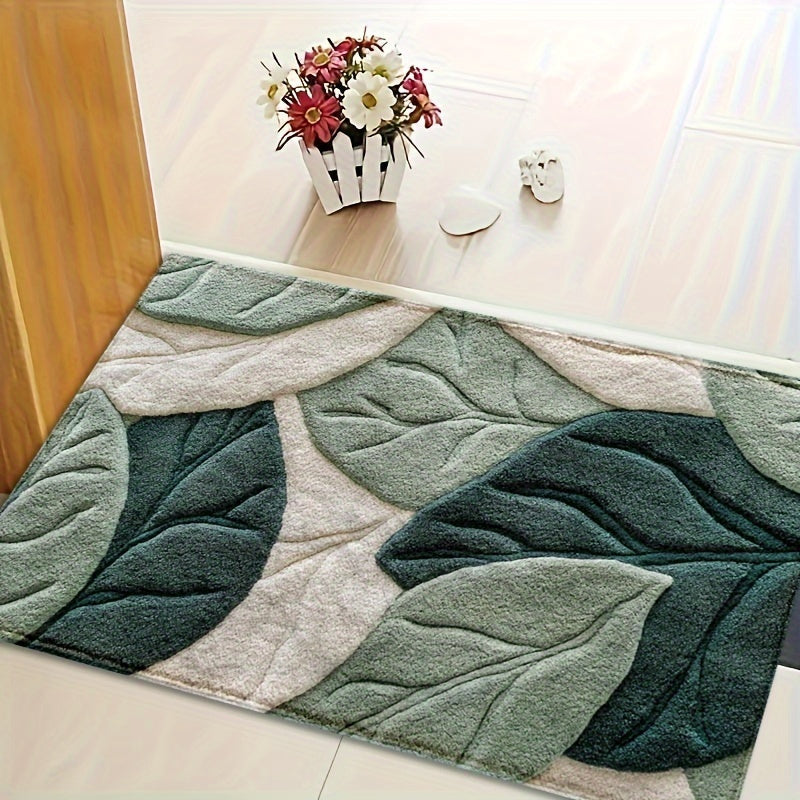 Gros plan du tapis de bain douillet en microfibre, motif feuilles vertes. Texture douce et absorbante.