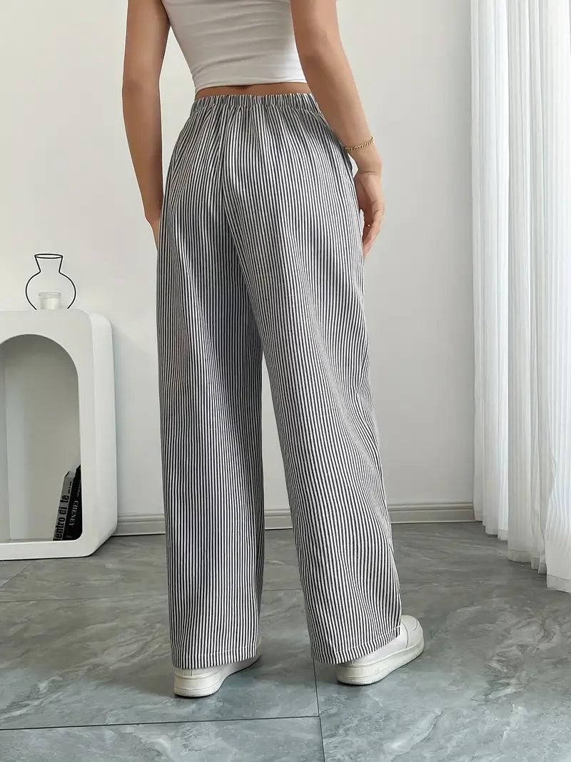 Pantalon femme, rayures élégantes, taille haute, silhouette élancée.