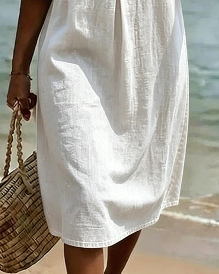 Magnifique robe fluide femme à manches volantées, pour une élégance décontractée en saison chaude.