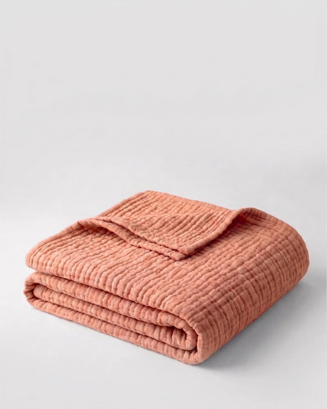 Plaid en mousseline de coton, léger, doux et respirant, pour un cocon de bien-être.