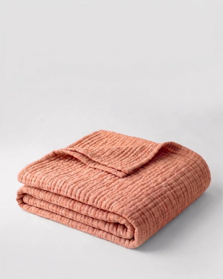 Plaid en mousseline de coton, léger, doux et respirant, pour un cocon de bien-être.