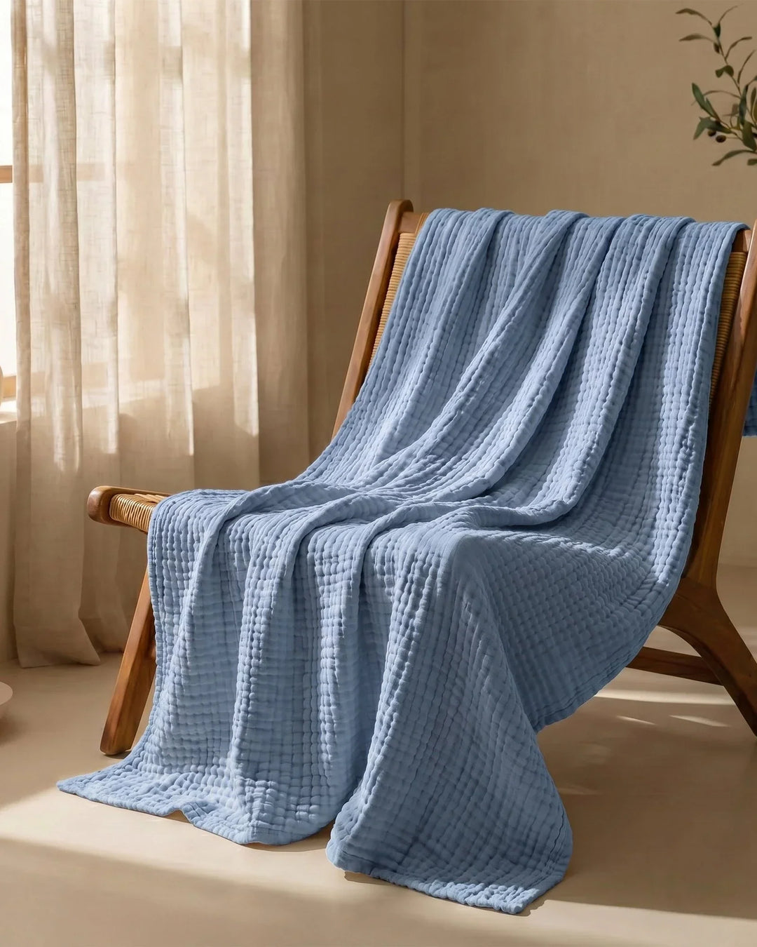 Couverture en coton doux, naturelle et respirante, parfaite pour une ambiance cosy.