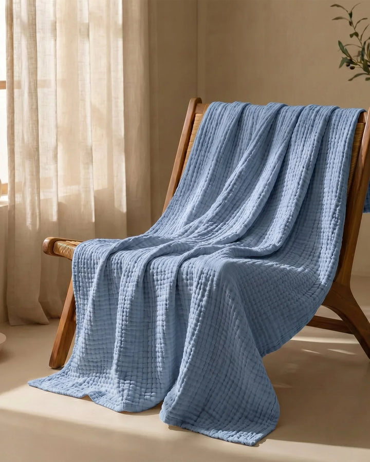 Couverture en coton doux, naturelle et respirante, parfaite pour une ambiance cosy.