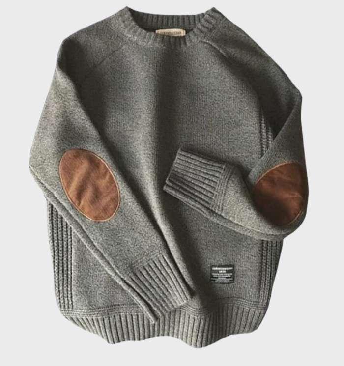 Ce pull élégant pour homme présente des patchs modes sur les manches, idéal pour l'hiver et l'automne.