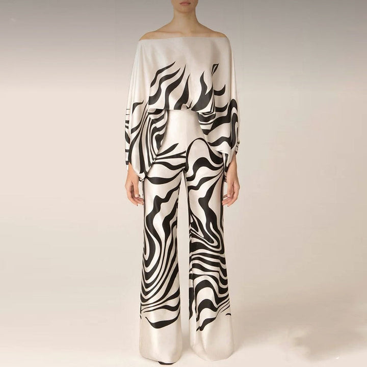 Ensemble femme deux pièces élégant : top épaules dénudées et pantalon large taille haute, parfait pour soirée chic.