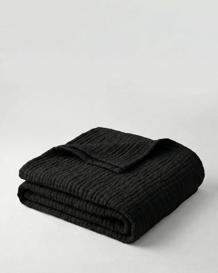 Plaid en coton, doux et élégant, parfait pour ajouter une touche de confort à votre maison.