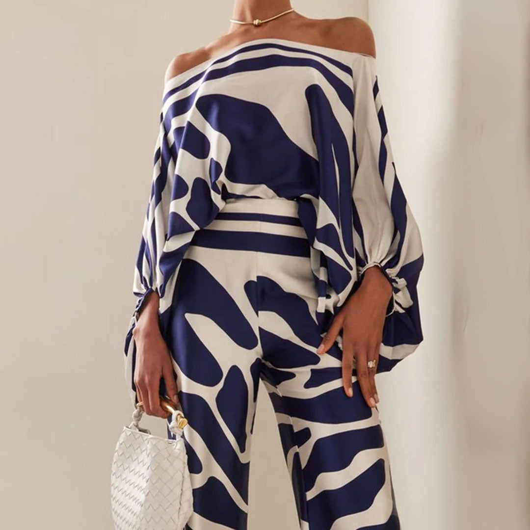 Ensemble femme simple et élégant : top épaules dénudées et pantalon fluide taille haute. Parfait pour une soirée d'été.